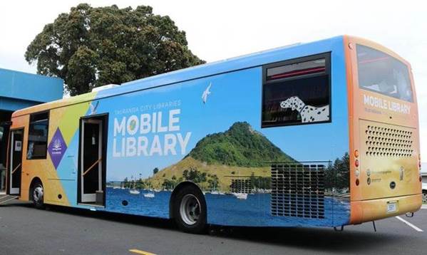 A picture containing text, road, bus, outdoor

Description automatically generated