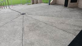 A concrete patio with a drain

Description automatically generated with medium confidence